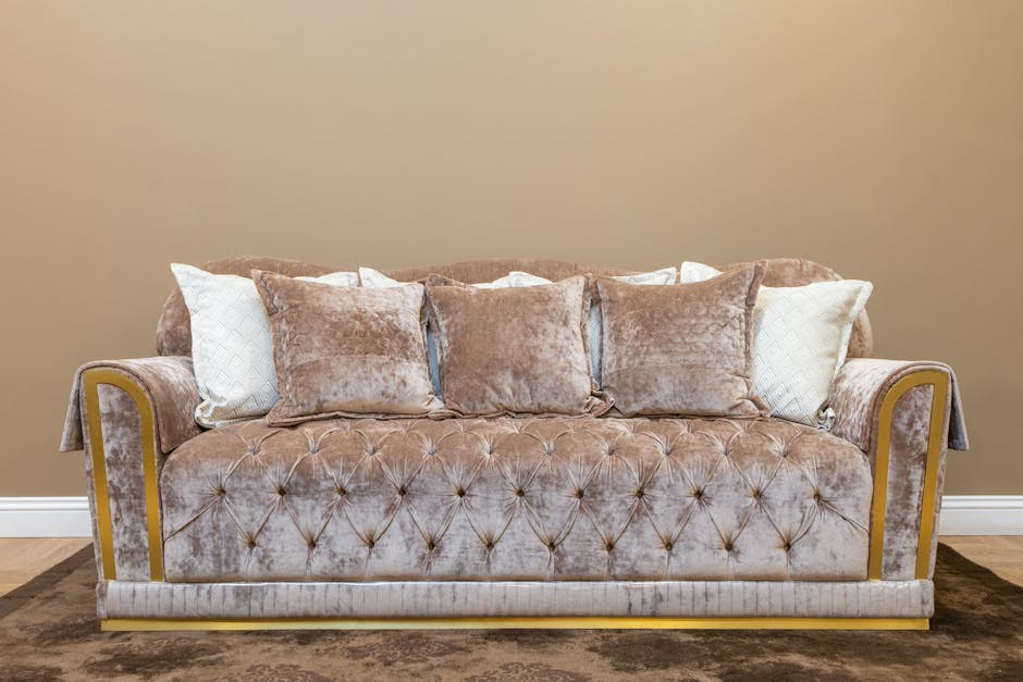 Luxurious beige sofa adorned with plush cushions in a stylish interior setting.